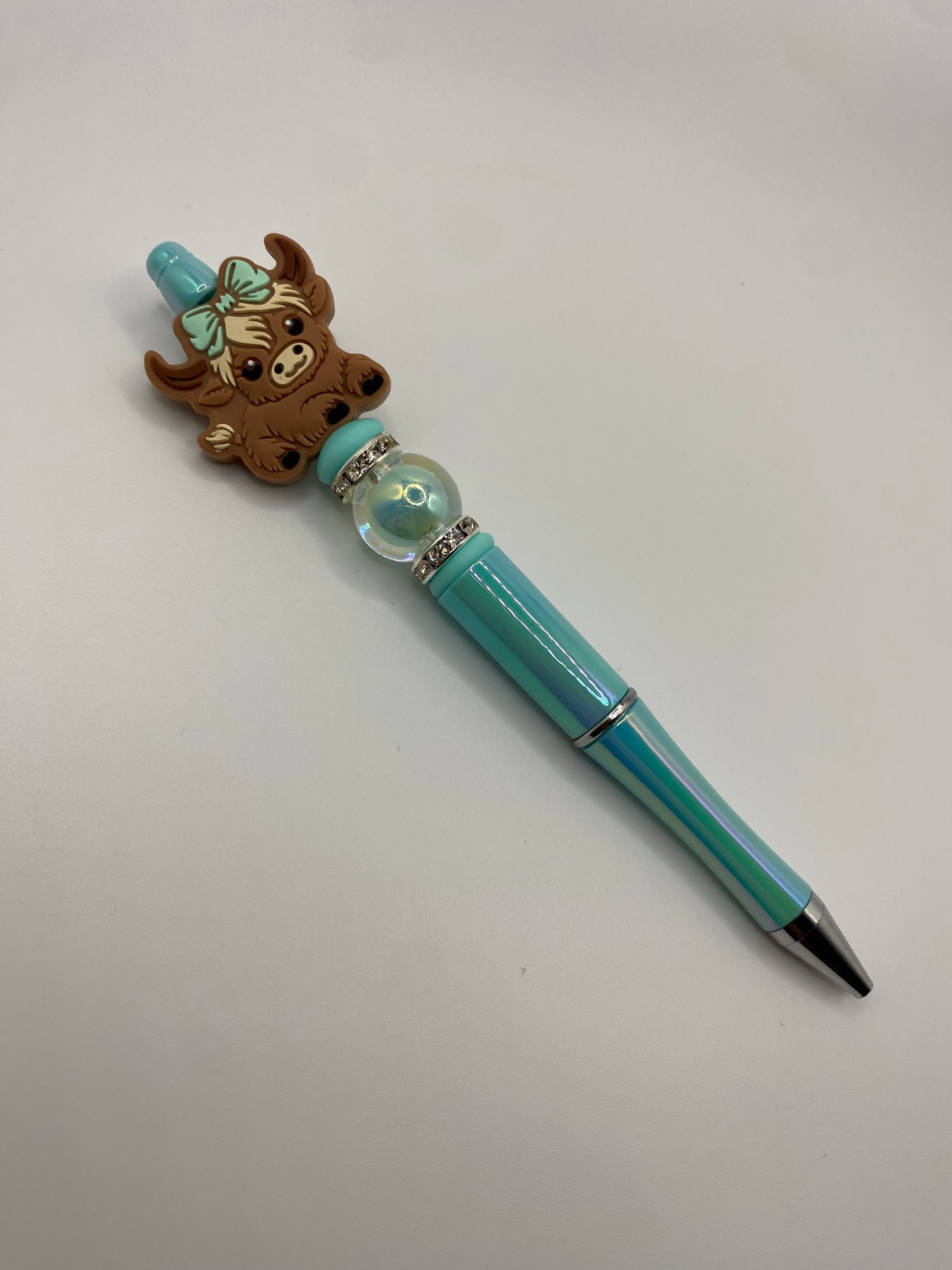 Cow with turquoise bow